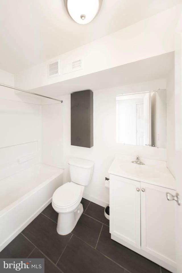 full bathroom featuring bathtub / shower combination, tile patterned flooring, vanity, and toilet