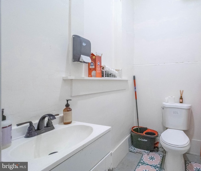 bathroom featuring vanity, toilet, and tile patterned floors