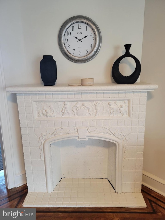 interior details featuring parquet flooring