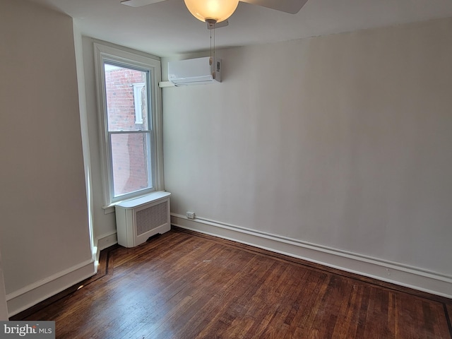 empty room with ceiling fan, radiator heating unit, dark wood-type flooring, a baseboard radiator, and an AC wall unit