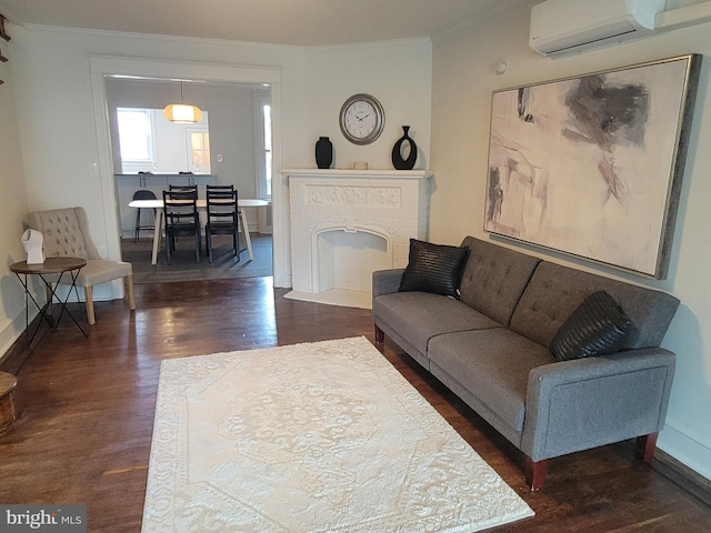 living room featuring ornamental molding, dark wood-type flooring, and a wall unit AC