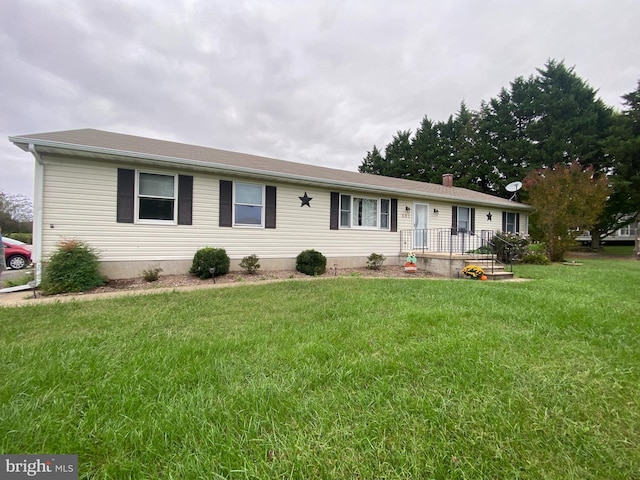 ranch-style house with a front lawn