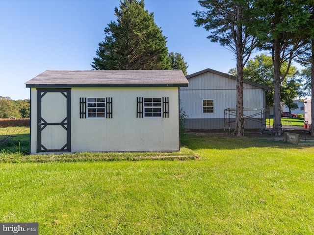 view of outdoor structure featuring a lawn