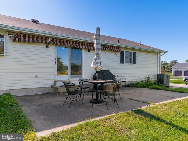 rear view of property featuring a yard and a patio area