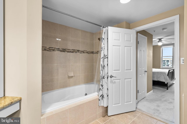 bathroom with shower / tub combo, tile patterned flooring, and ceiling fan