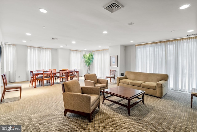 carpeted living room featuring plenty of natural light