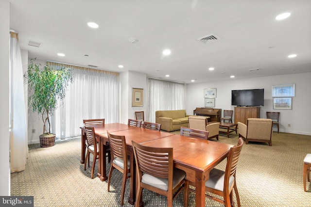 dining room with light carpet