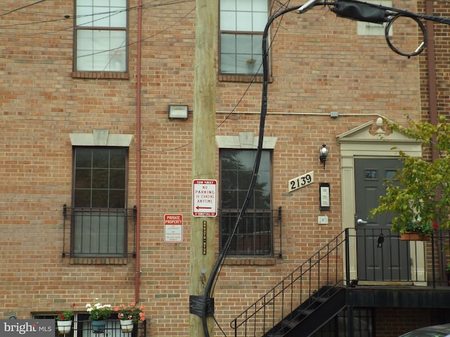 property entrance with brick siding