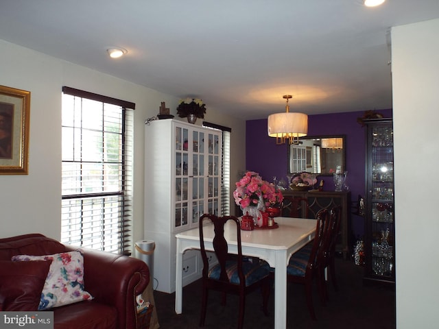 dining area featuring an inviting chandelier