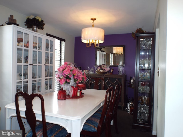 dining space with a chandelier