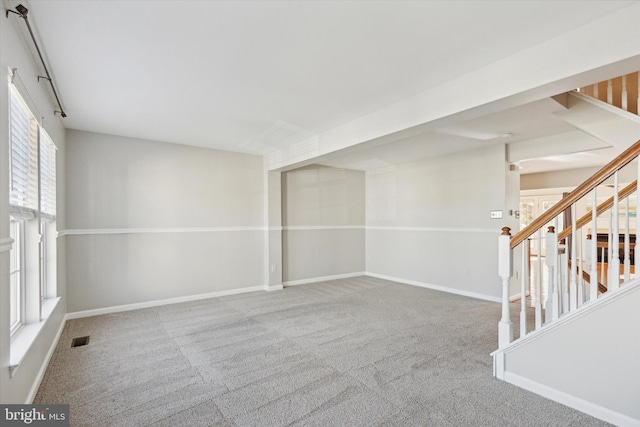 unfurnished room featuring carpet floors