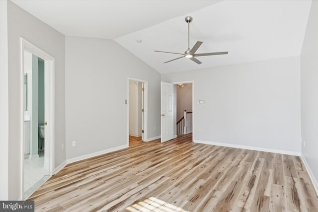 unfurnished bedroom with vaulted ceiling, light hardwood / wood-style flooring, ensuite bath, and ceiling fan