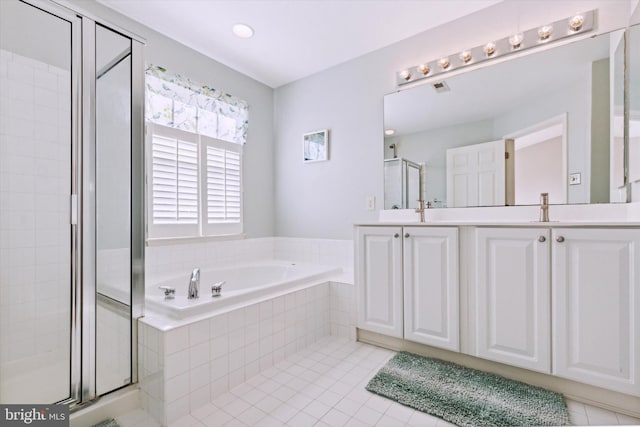 bathroom with separate shower and tub, tile patterned flooring, and vanity