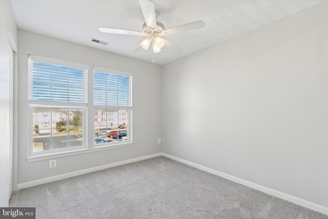 empty room with carpet and ceiling fan