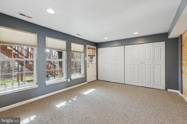 unfurnished bedroom with carpet