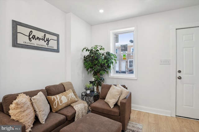 living area with hardwood / wood-style floors