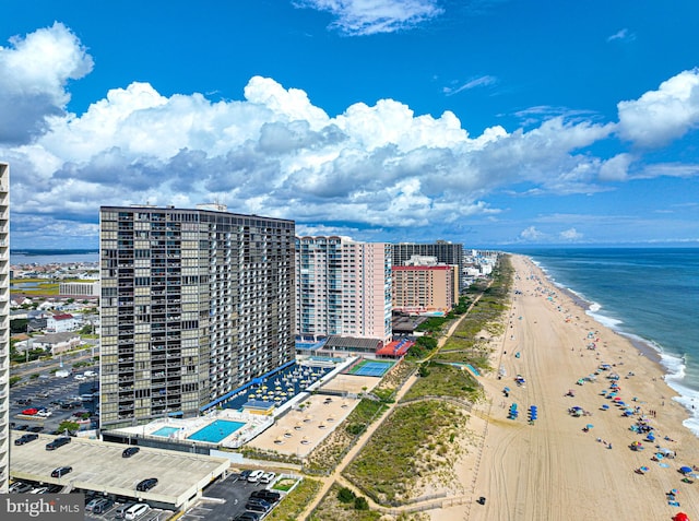 birds eye view of property with a view of the beach and a water view