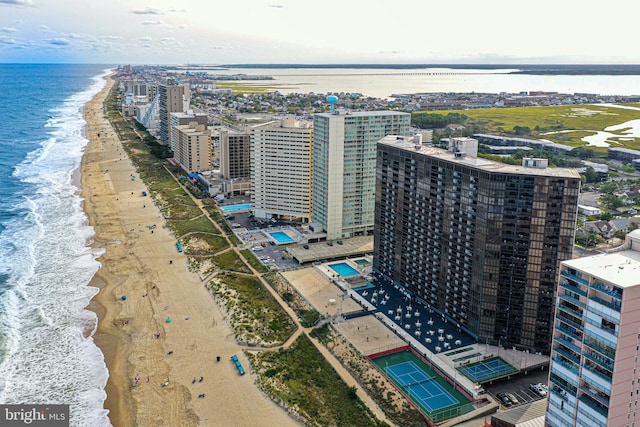 bird's eye view featuring a water view and a beach view