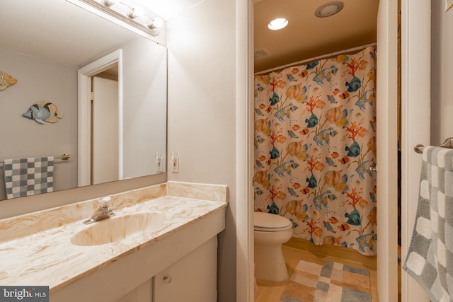 bathroom with tile patterned flooring, curtained shower, vanity, and toilet