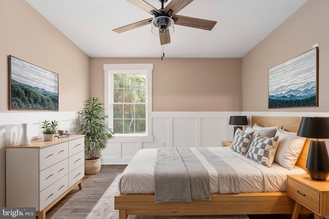 bedroom featuring wood-type flooring and ceiling fan