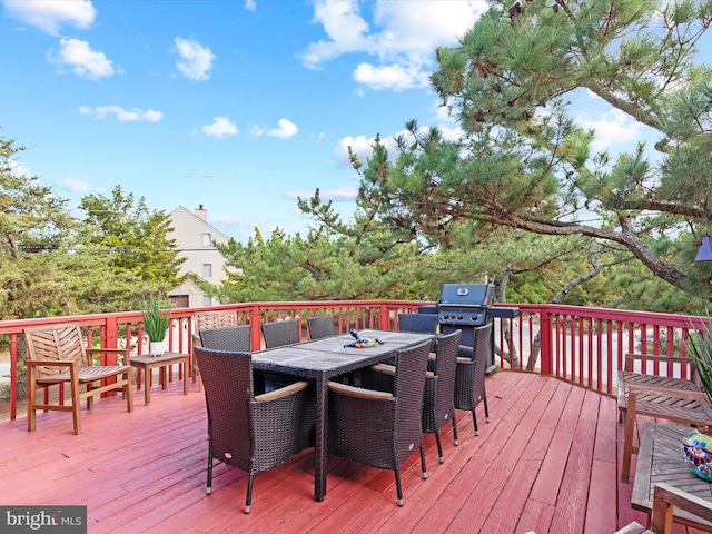 wooden deck with grilling area