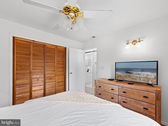 bedroom featuring ceiling fan and a closet