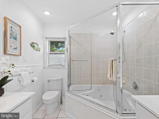 full bathroom with bath / shower combo with glass door, vanity, toilet, and tile patterned floors