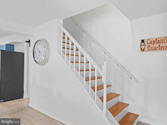 staircase featuring hardwood / wood-style flooring