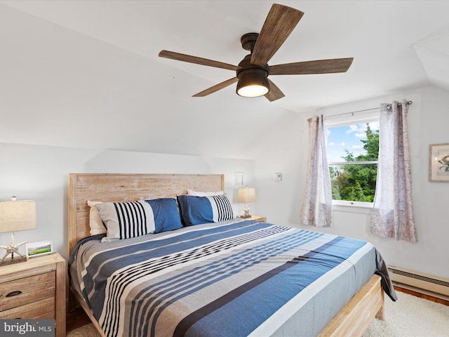 carpeted bedroom featuring lofted ceiling, a baseboard radiator, and ceiling fan