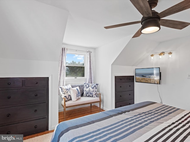 bedroom featuring lofted ceiling, light hardwood / wood-style floors, and ceiling fan