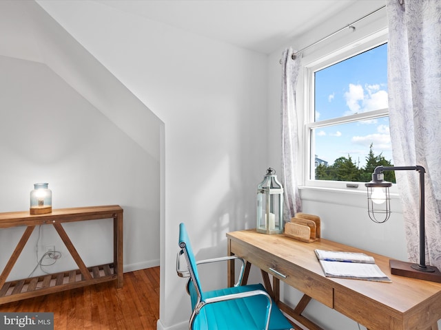 office area with plenty of natural light and hardwood / wood-style floors