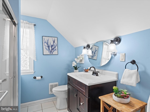 bathroom featuring vaulted ceiling, vanity, tile patterned flooring, and toilet