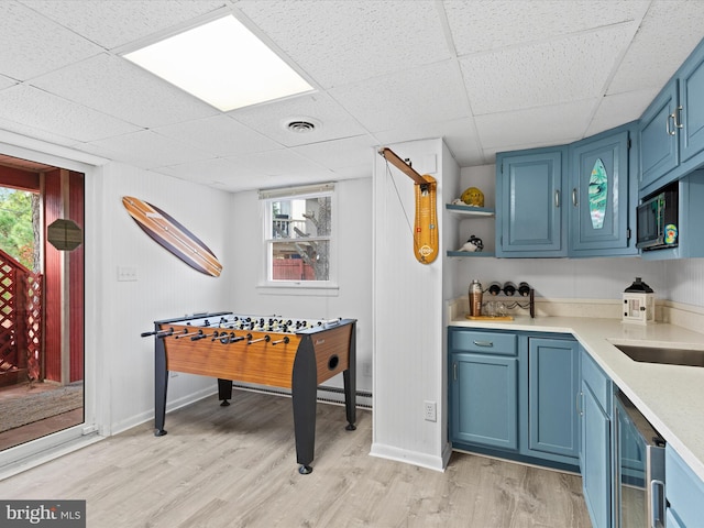 playroom with a drop ceiling and light hardwood / wood-style floors