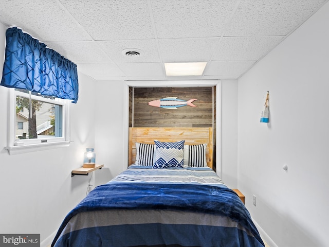 bedroom featuring a drop ceiling