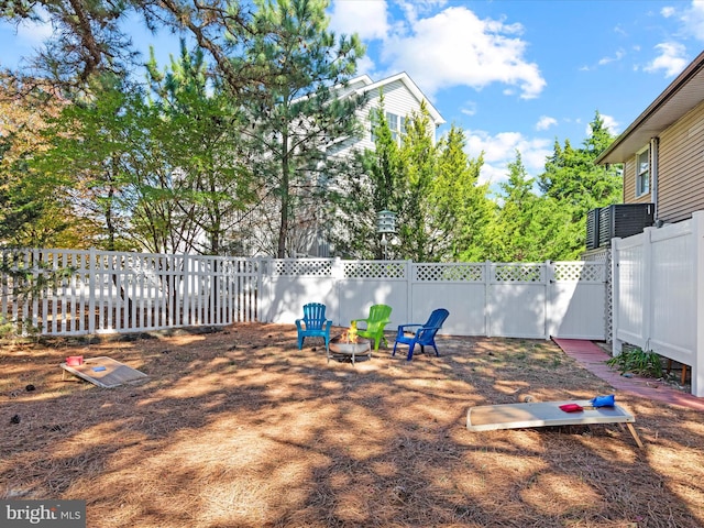 view of yard featuring an outdoor fire pit