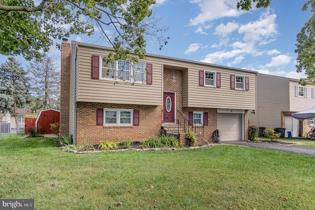 bi-level home with a garage and a front lawn