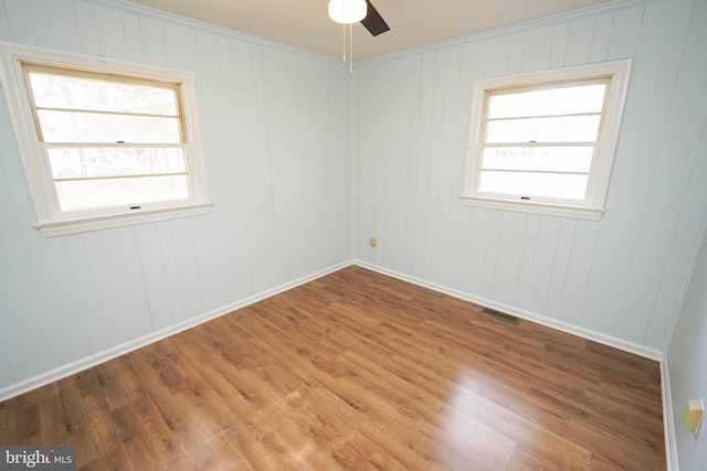 empty room featuring ceiling fan and wood-type flooring