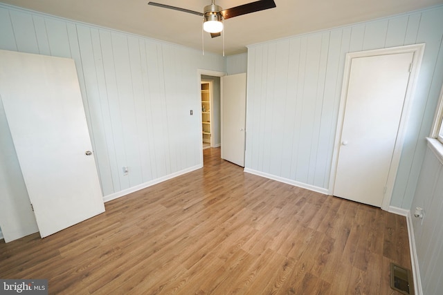 unfurnished bedroom featuring ceiling fan and light hardwood / wood-style floors