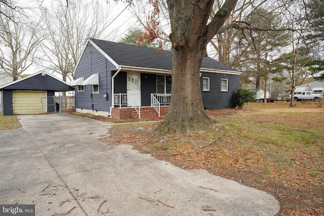 view of front of home with a porch, an outdoor structure, and a garage