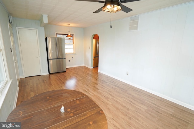 interior space featuring ceiling fan and wood-type flooring