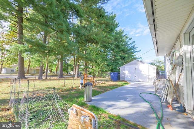 view of yard with a garage and an outdoor structure