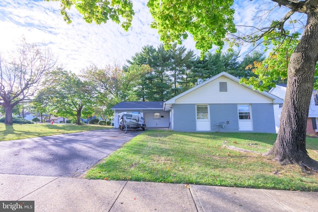 single story home featuring a front lawn and a carport