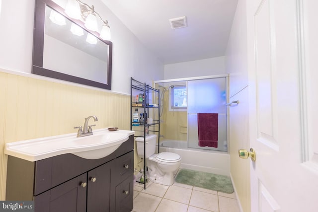 full bathroom with tile patterned flooring, toilet, shower / bathtub combination, and vanity