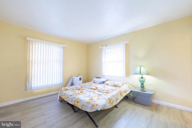 bedroom with light wood-type flooring