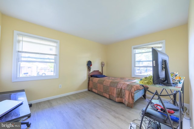 bedroom with light hardwood / wood-style floors