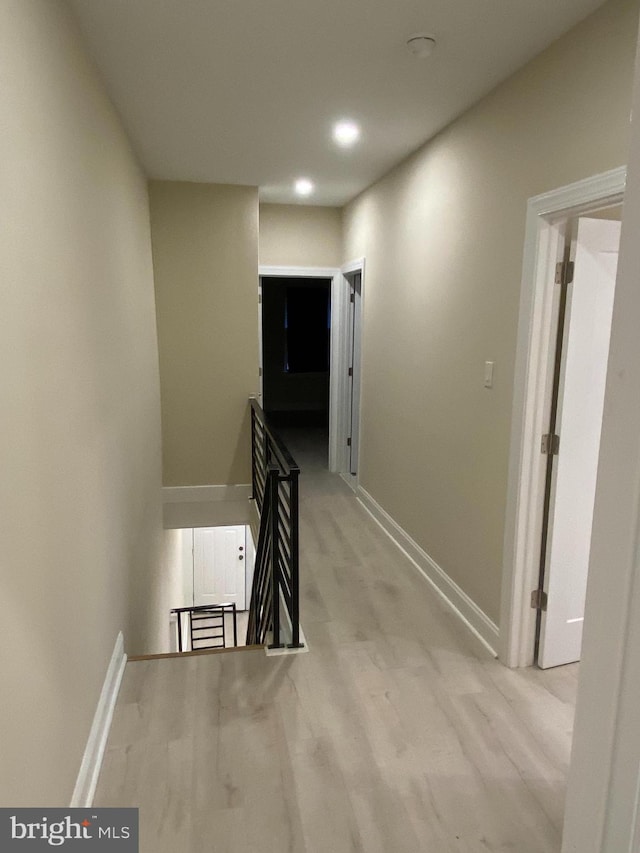 corridor featuring light hardwood / wood-style floors