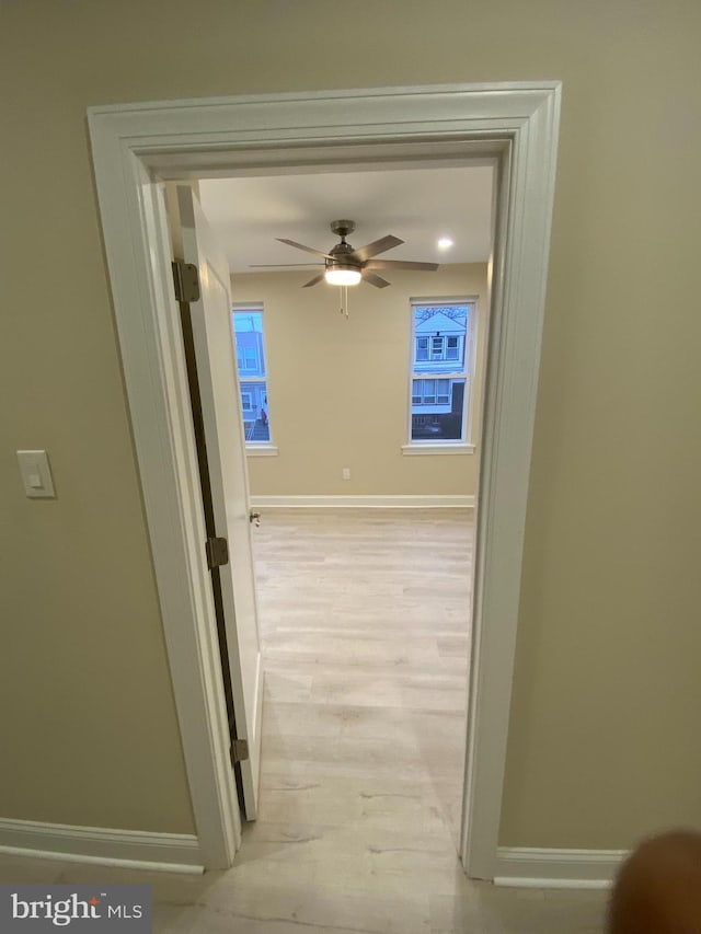 hallway featuring light wood-type flooring