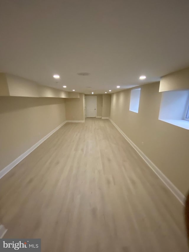 basement featuring light wood-type flooring