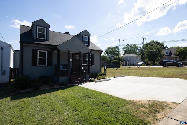 view of front facade with a front lawn and covered porch