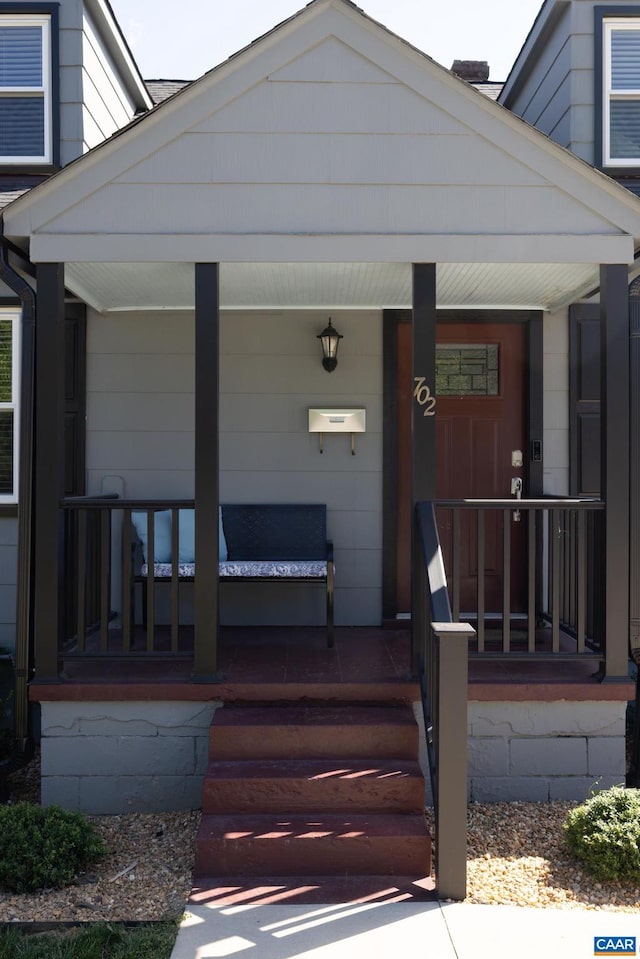 property entrance with covered porch